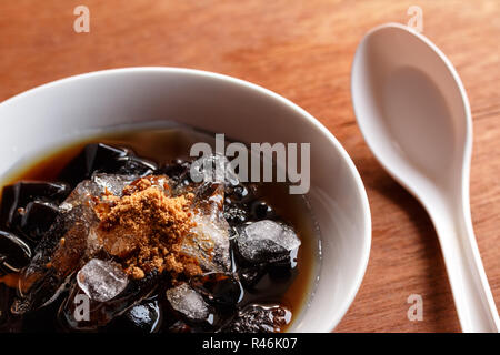 grass jelly dessert, herbal gelatin, Chinese style. Stock Photo