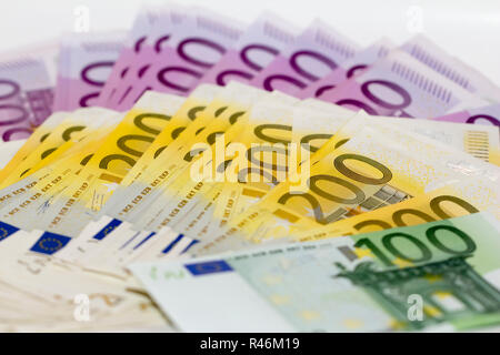 Isolated stack of money with 100 200 and 500 euro banknotes Stock Photo