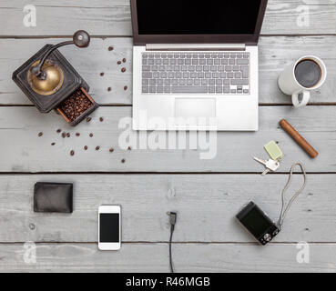 Workspace on a wooden table from above Stock Photo