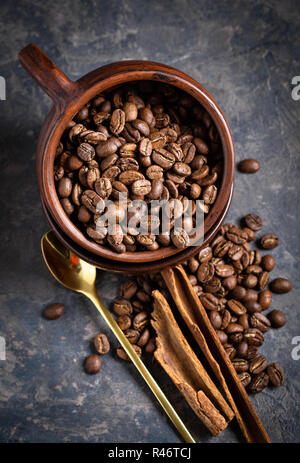 Coffee beans in old mug Stock Photo