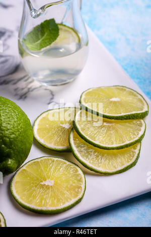 Sliced lime and juice Stock Photo