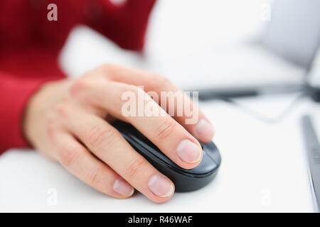 Male hand used computer mose holding in arm Stock Photo