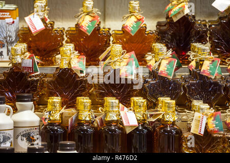MONTREAL, CANADA - NOVEMBER 3, 2018: Maple Syrup bottles for sale on Montreal Jean Talon market. Quebec is the highest producer of Maple syrup in the  Stock Photo