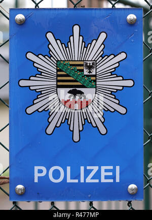 sign on the fence of a police station in magdeburg Stock Photo