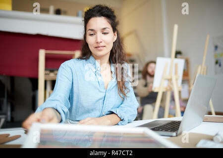 Woman by workplace Stock Photo