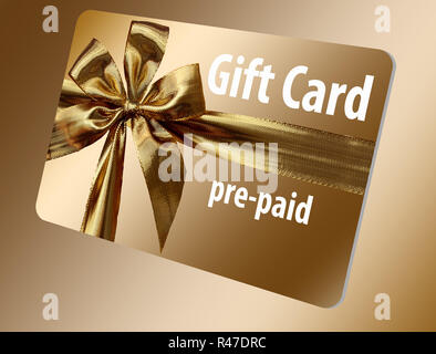 A pre-paid gift card is seen here. It is gold with a gold ribbon design on the front. Stock Photo