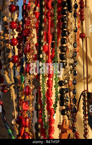 Rosaries hung on a religious status as a request for something at Our Lady of Guadalupe Shrine, frequented by Hispanics and immigrants, located in Des Plaines, Illinois. Stock Photo