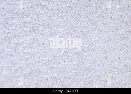 Background from filler of small white pieces of Styrofoam for packaging. Stock Photo