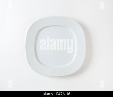 Wide rimmed square plate Stock Photo