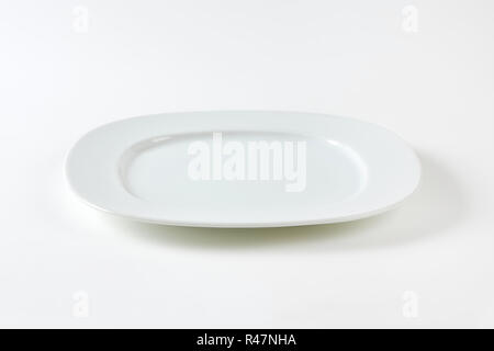 Wide rimmed square plate Stock Photo