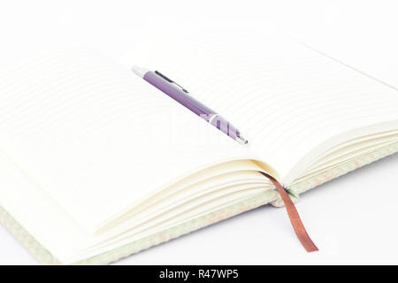 Notebook with pen isolated on white background Stock Photo
