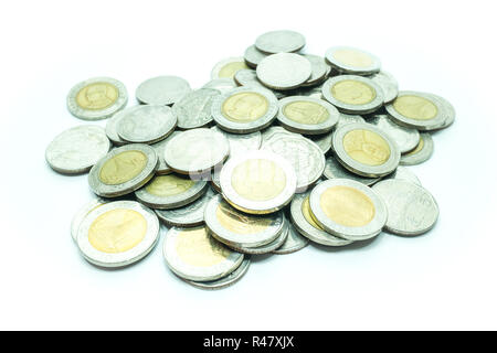 Group of Thai baht coins on white table background Stock Photo