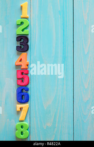 Set of plastic numbers on wooden background with copy-space Stock Photo ...