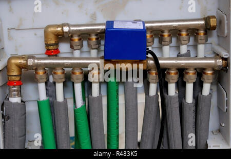 Collector, manifold, heating system for underfloor heating Stock Photo