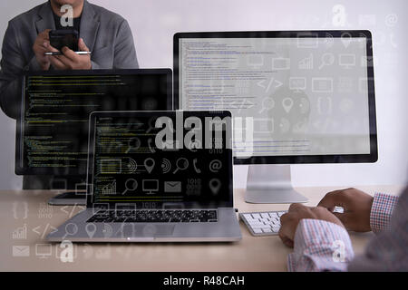 man work Coding software developer programmer is coding on a desktop computer Stock Photo