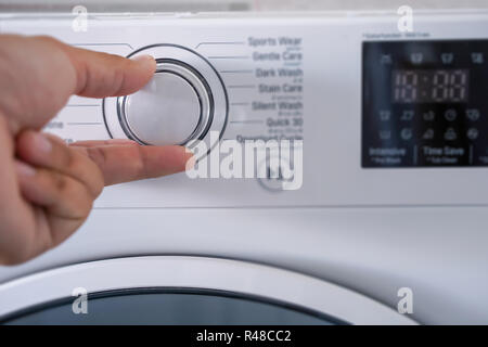 washing machine Choosing Program On Washing Machine Stock Photo