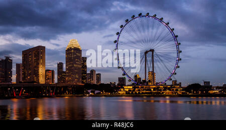 Evening view of Singapore Flyer and the city Stock Photo