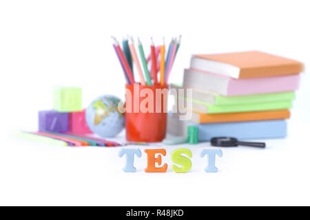 word test on the background of school supplies .photo with copy  Stock Photo