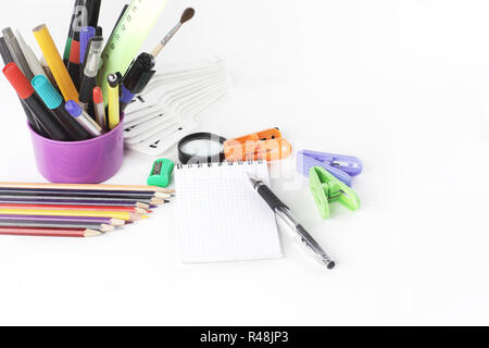 notebook and office supplies .isolated on white background Stock Photo