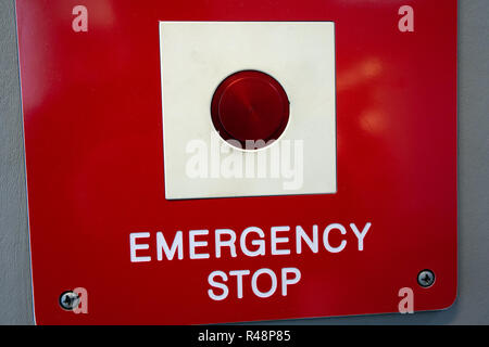 Red Emergency Stop Button on London Underground Tube wall Stock Photo