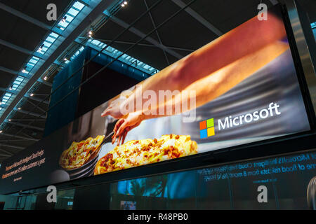 Dynamic Digital Signage Advertising poster for Microsoft at Heathrow Airport International Airport in London, United Kingdom. Stock Photo