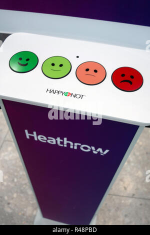 Happy or Not voting for service buttons at Check-in at Heathrow Airport International Airport in London, United Kingdom. Stock Photo