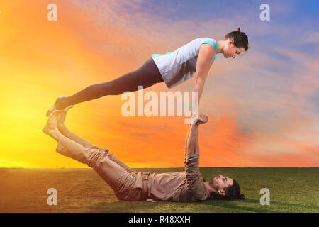 Two young people doing yoga indoors stock photo (132659