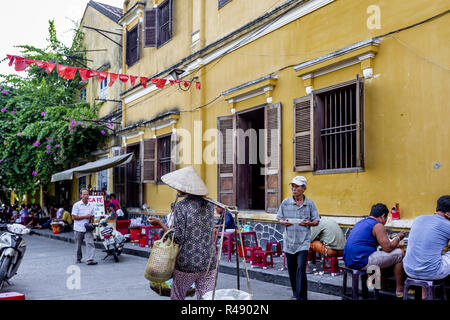 Editorial: Aug 16, 2017, outdoor coffee shop, Hoi An Ancient Town. Street Cafe with locals and tourist enjoying coffee outside. Stock Photo