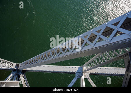 The truss Bridge of God over the Columbia River is located in a picturesque area of Columbia Gorge with hills and rocky mountains forest covered - an  Stock Photo