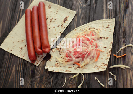homemade sausage, pita bread and pickled cabbage for making Shaw Stock Photo