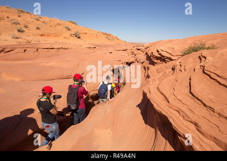 A group of tourists is entering famous Antelope Canyon near the historic town of Page, Arizona, USA Stock Photo
