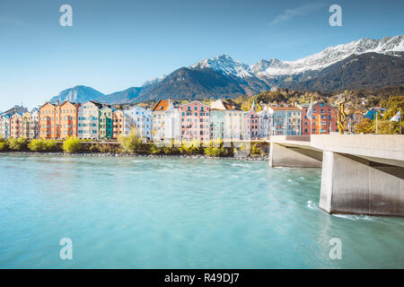 Historic city center of Innsbruck with colorful houses along Inn river and famous Austrian mountain summits in the background, Tyrol, Austria Stock Photo