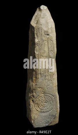 Stele of a Warrior. 1100-850 BC. It depicts a human figure with helmet and horns, sword, shield and spear. Slate. Late Bronze Age. From Magacela, province of Badajoz, Extremadura, Spain. National Archaeological Museum. Madrid. Spain. Stock Photo