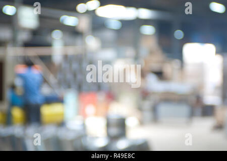 Abstract blurred industrial background image of a water-heaters steel factory interior Stock Photo
