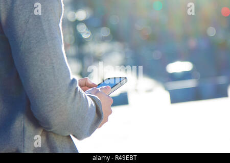 Young man chatting with their smartphone Stock Photo