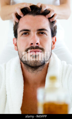 Masseur doing massage on man body in the spa salon. Beauty treatment