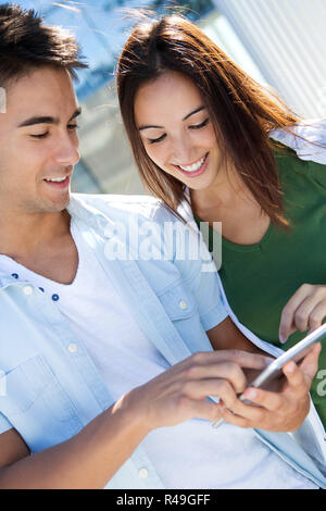 young couple using a digital tablet Stock Photo