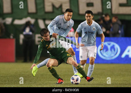 Portland, Oregon, USA. November 25, 2018: Sporting KC forward Daniel Salloi (20) pulls Portland Timbers defender Jorge Villafana (4) down to the ground during a game between Sporting KC and the Portland Timbers at Providence Park in Portland, OR. Sporting KC and the Timbers tied 0-0 in the first leg of the MLS Western Conference Finals. Sean Brown/CSM Credit: Cal Sport Media/Alamy Live News Stock Photo