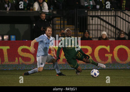 Portland, Oregon, USA. November 25, 2018: Sporting KC defender Seth Sinovic (15) fouls Portland Timbers midfielder Dairon Asprilla (27) during a game between Sporting KC and the Portland Timbers at Providence Park in Portland, OR. Sporting KC and the Timbers tied 0-0 in the first leg of the MLS Western Conference Finals. Sean Brown/CSM Credit: Cal Sport Media/Alamy Live News Stock Photo