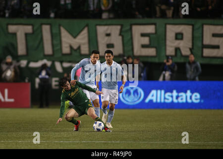 Portland, Oregon, USA. November 25, 2018: Portland Timbers defender Jorge Villafana (4) tries to hold off Sporting KC forward Daniel Salloi (20) during a game between Sporting KC and the Portland Timbers at Providence Park in Portland, OR. Sporting KC and the Timbers tied 0-0 in the first leg of the MLS Western Conference Finals. Sean Brown/CSM Credit: Cal Sport Media/Alamy Live News Stock Photo