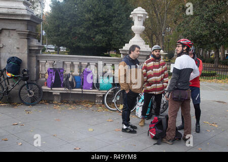 Madrid, Spain. 26th Nov, 2018. Bicycle dealers are seen speaking to each other during the protest.Hundreds of delivery people on bicycles from different companies such as Uber Eats, Glovo or Deliveroo, have met in Madrid to protest and to inform people about their situation. The distributors in bicycles of these companies denounce the labor precariousness in their sector and distributors of all the Spanish cities after the two days reunited in the assembly and decided to create an association to demand for their labor situation with the company must be recognized and they should stop bein Stock Photo
