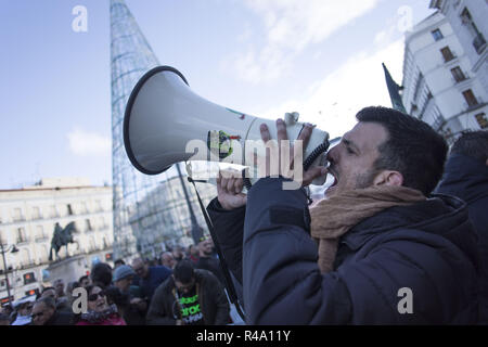 Madrid, Madrid, Spain. 26th Nov, 2018. A protester seen chanting slogans on a megaphone during the demonstration.A sector of taxi drivers were gathered in Madrid to ask the municipality and pressure them for faster solutions in the regulations of the VTC Credit: Bruno Thevenin/SOPA Images/ZUMA Wire/Alamy Live News Stock Photo
