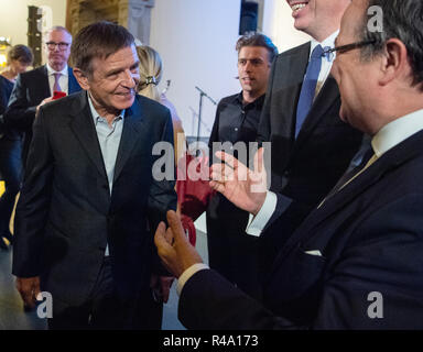 26 November 2018, North Rhine-Westphalia, Düsseldorf: Andreas Gursky (l), artist, is welcomed by Armin Laschet (CDU, r), Prime Minister of North Rhine-Westphalia, before the award ceremony of the Great Cultural Prize of the Sparkassen-Kulturstiftung Rheinland in the K21 Ständehaus. Photo: Christophe Gateau/dpa Stock Photo