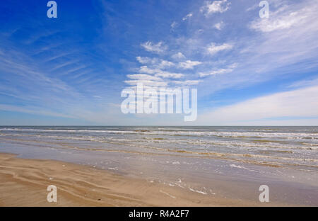 Cloud Patterns over an Ocean Beach Stock Photo