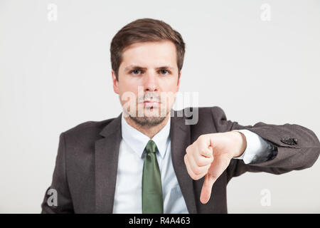 disagreeing businessman with thump down Stock Photo