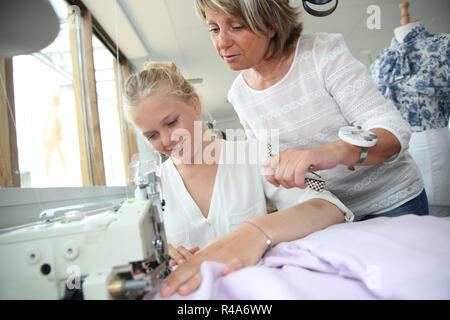 Student with teacher in dressmaking class Stock Photo