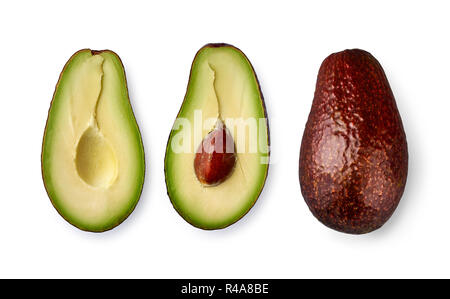 Whole avocado fruit and two halves in a row isolated on white background. Stock Photo