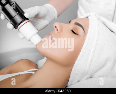 procedure wrinkle treatment , acoustic wave therapy on face Stock Photo