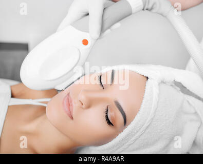 procedure of skin rejuvenation , ELOS rejuvenation technology for removes brown spots Stock Photo