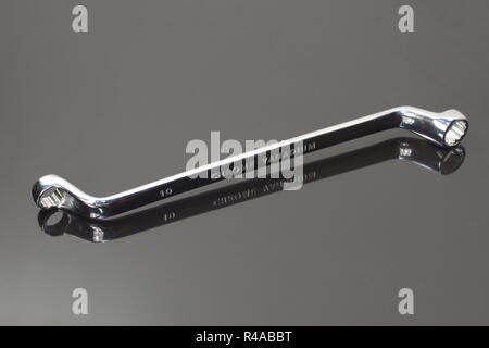 ring profile matal spanner on dark background Stock Photo